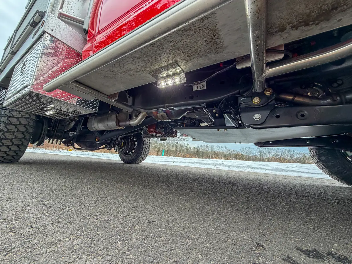 Underside chassis view showing crossmembers and exhaust routing.